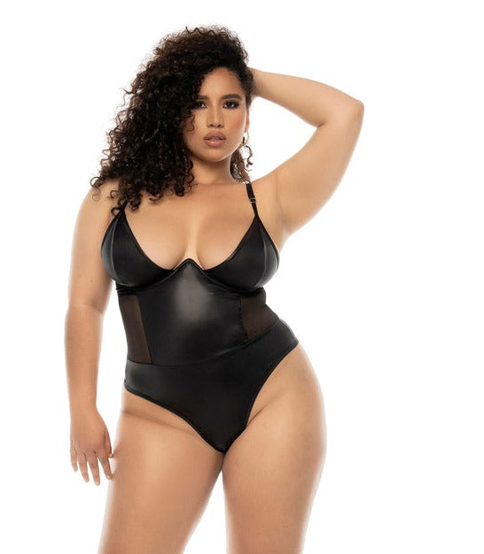 Plus size model wearing CT Lingerie plus size black bodysuit lingerie with underwire cups mesh side panels and adjustable straps