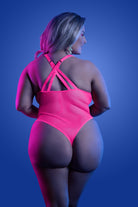 CT Lingerie plus size neon lingerie bodysuit in hot pink with crisscross back straps on model
