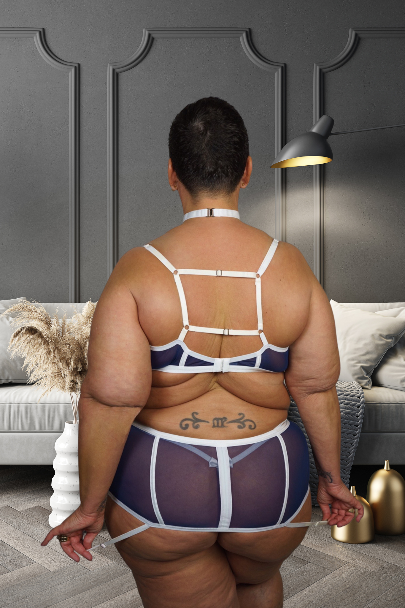 CT Lingerie clearance navy sheer applique lingerie for curvy women back view with strappy bra and waist panties in living room