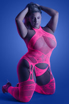 CT Lingerie neon pink fishnet plus size lingerie bodystocking with cutout garter details modeled kneeling
