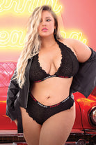 CT Lingerie plus size black lace bralette and panty set with scalloped edges modeled with leather jacket