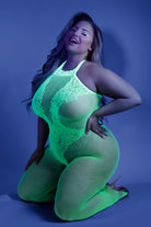 Plus size model kneeling in neon lace fishnet bodystocking by CT Lingerie Moonbeam Glow In the Dark BodySuit