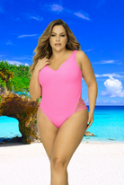 Plus size model wearing CT Lingerie Luxe Hot Pink One Piece Swimsuit on a tropical beach background