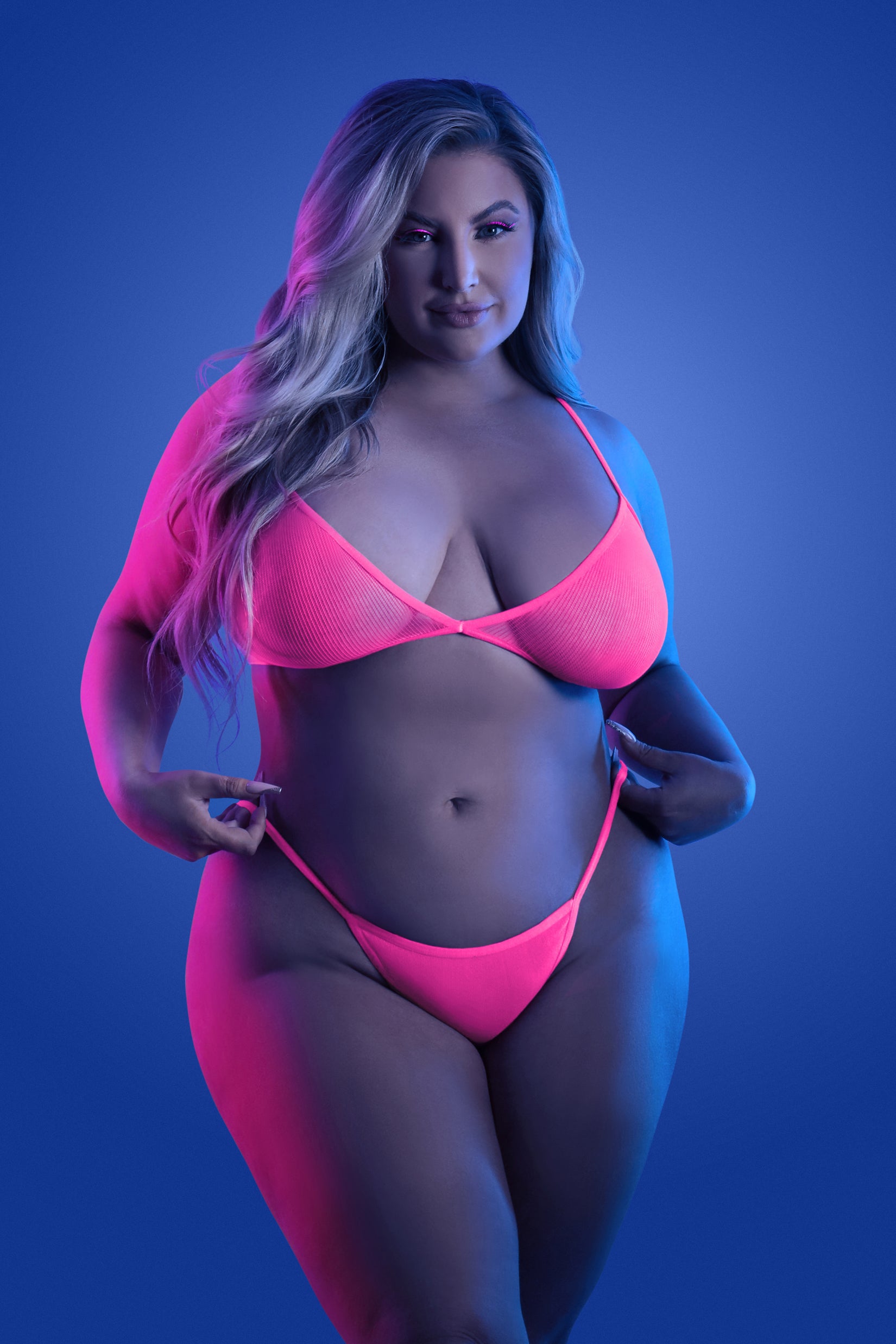 CT Lingerie plus size neon lingerie bright pink two piece set on curvy model in studio lighting